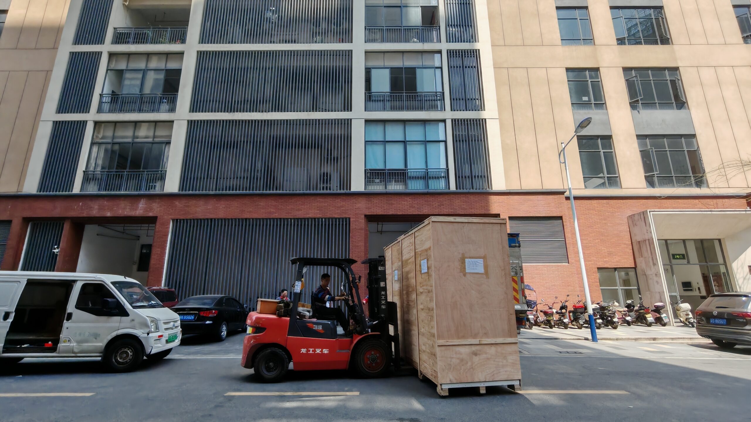Forklift loading packed ultrasonic cleaning equipment for shipment