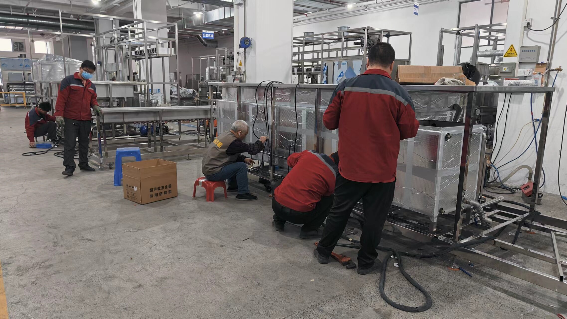 Lush Trees Tech technicians assembling industrial ultrasonic cleaning equipment in the Dongguan factory